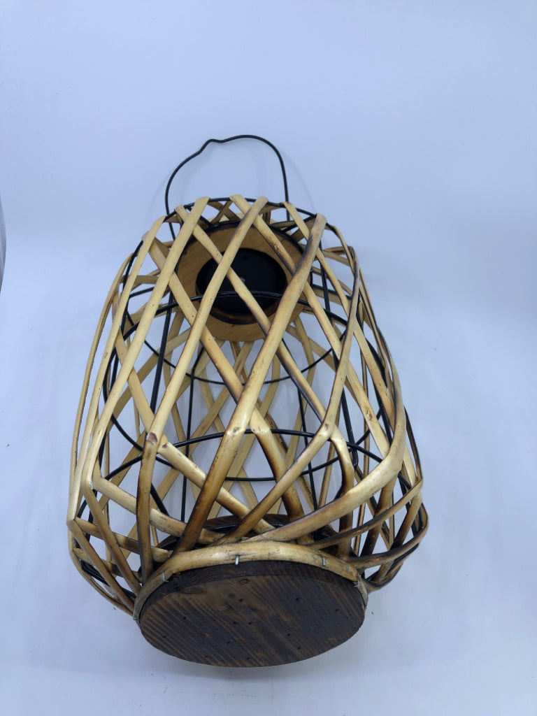 SOLAR POWERED WICKER LANTERN.