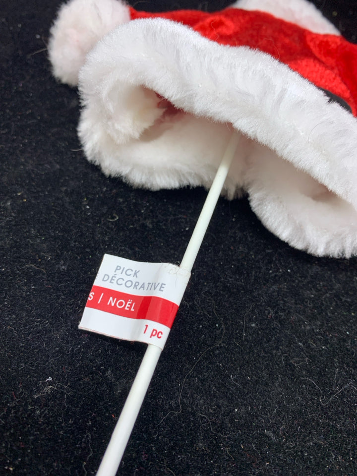SANTA COAT ON A STICK.