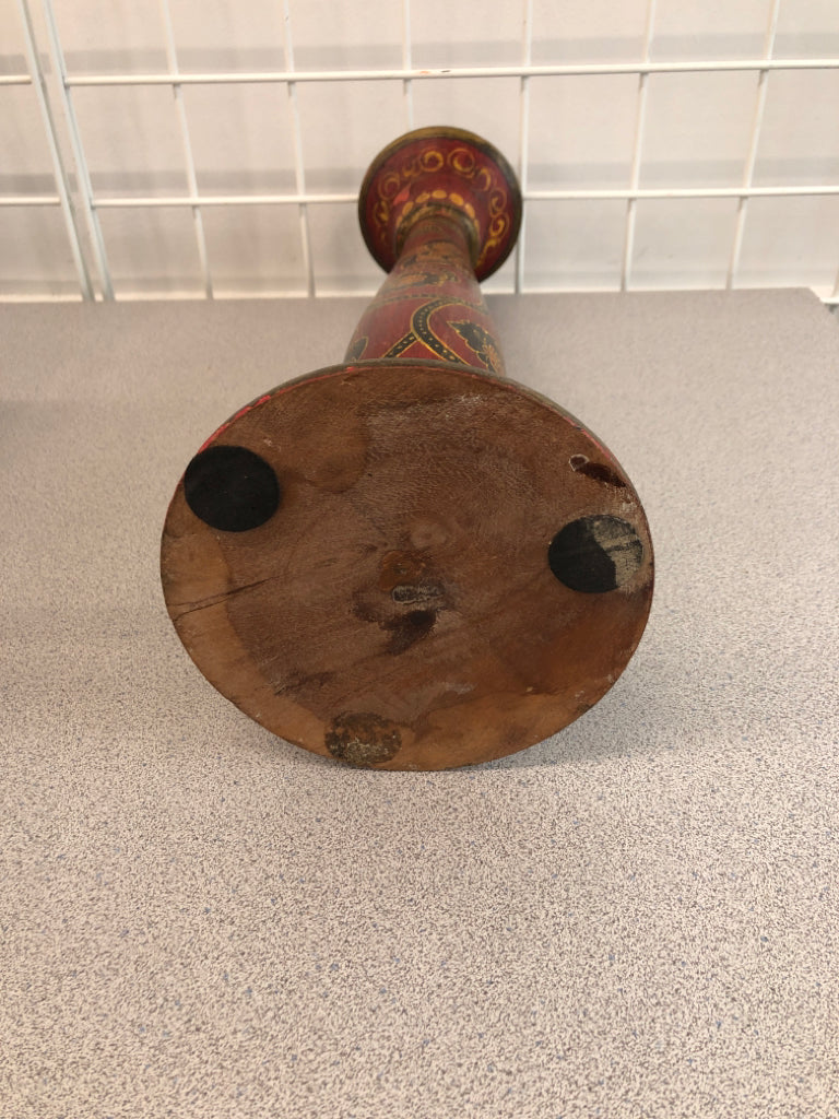 RED WOOD PILLAR CANDLE HOLDER W/BLACK FLOWERS.