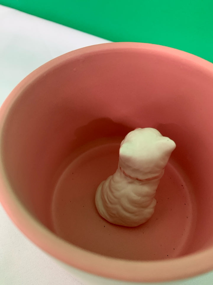 WHITE MATTE MUG W PINK BOWS AND WHITE CAT INSIDE.