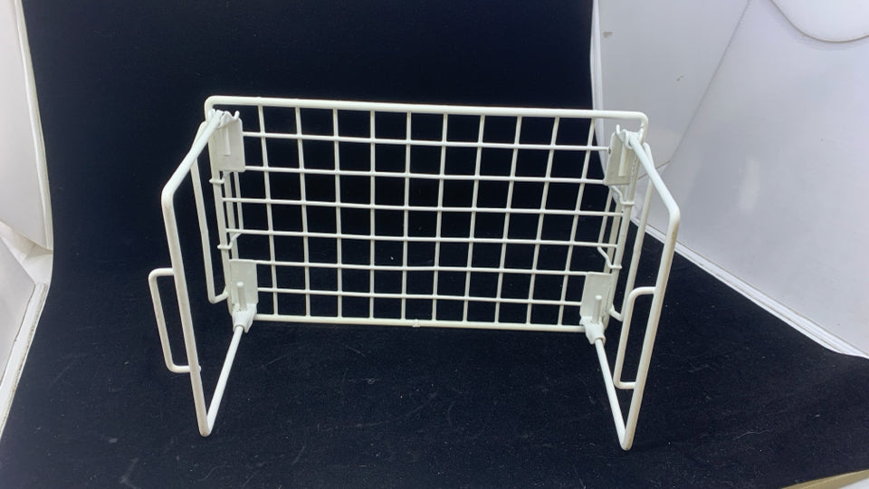 WHITE FOLDING WIRE RACK.