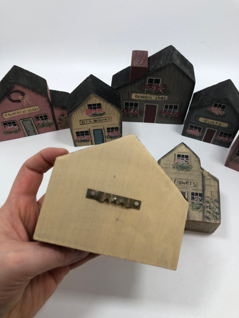 7 WOOD PAINTED BLOCK HOUSES IN BAG.