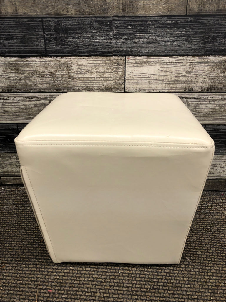 WHITE FAUX LEATHER OTTOMAN.