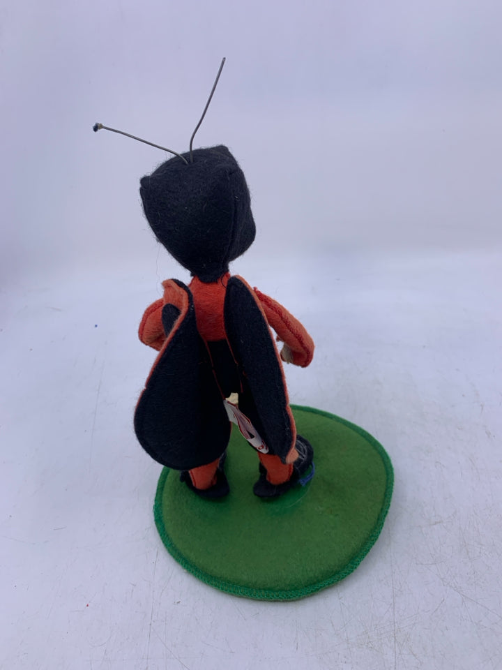 PERSON DRESSED AS LADY BUG.