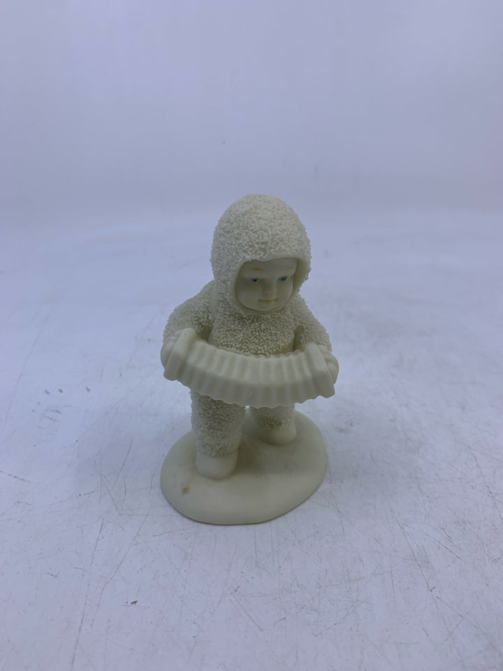 SNOW BABY HOLDING ACCORDION WALKING.