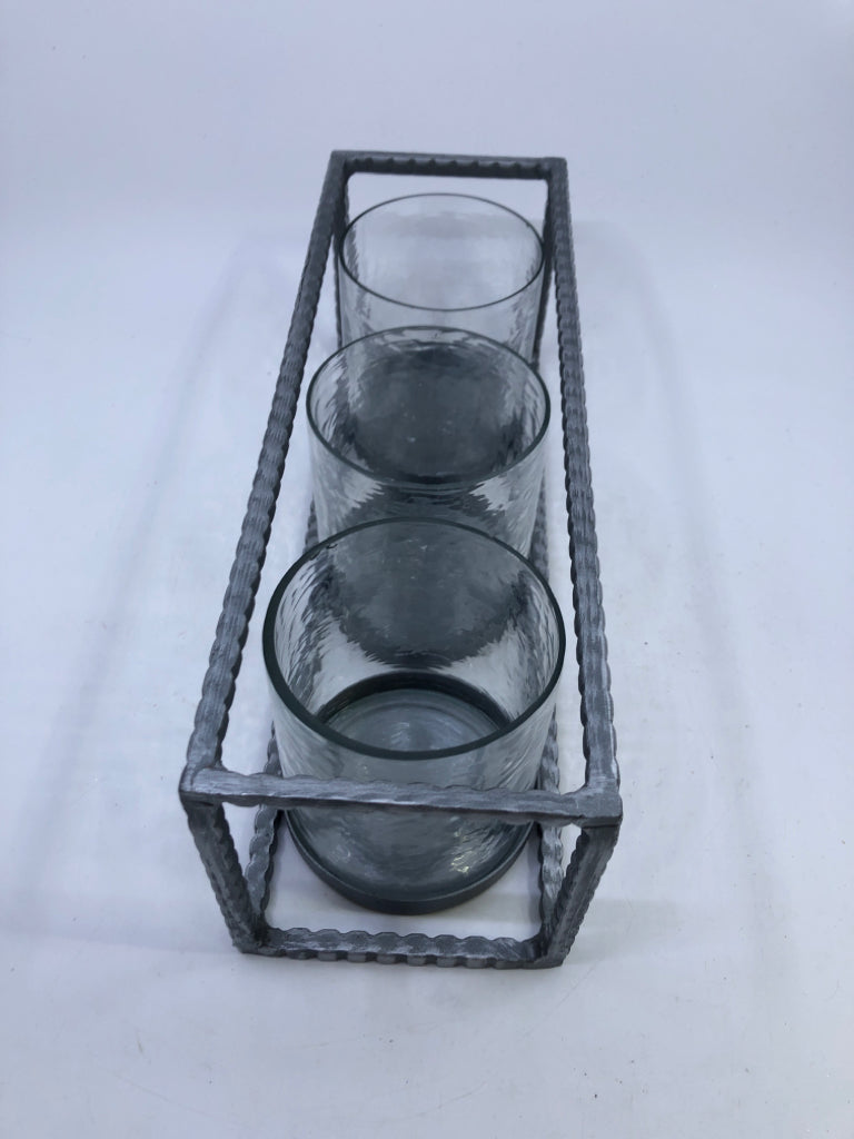 3 CANDLE HOLDERS IN METAL HOLDER.
