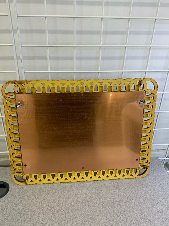 VTG BRONZE FRUIT IN WOVEN PLASTIC FRAME, COPPER BACKGROUND.