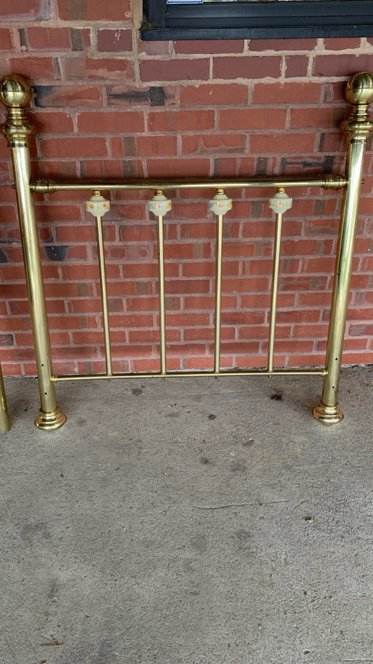 BRASS TWIN BED FRAME W/CERAMIC FLORAL BALL DETAILS.