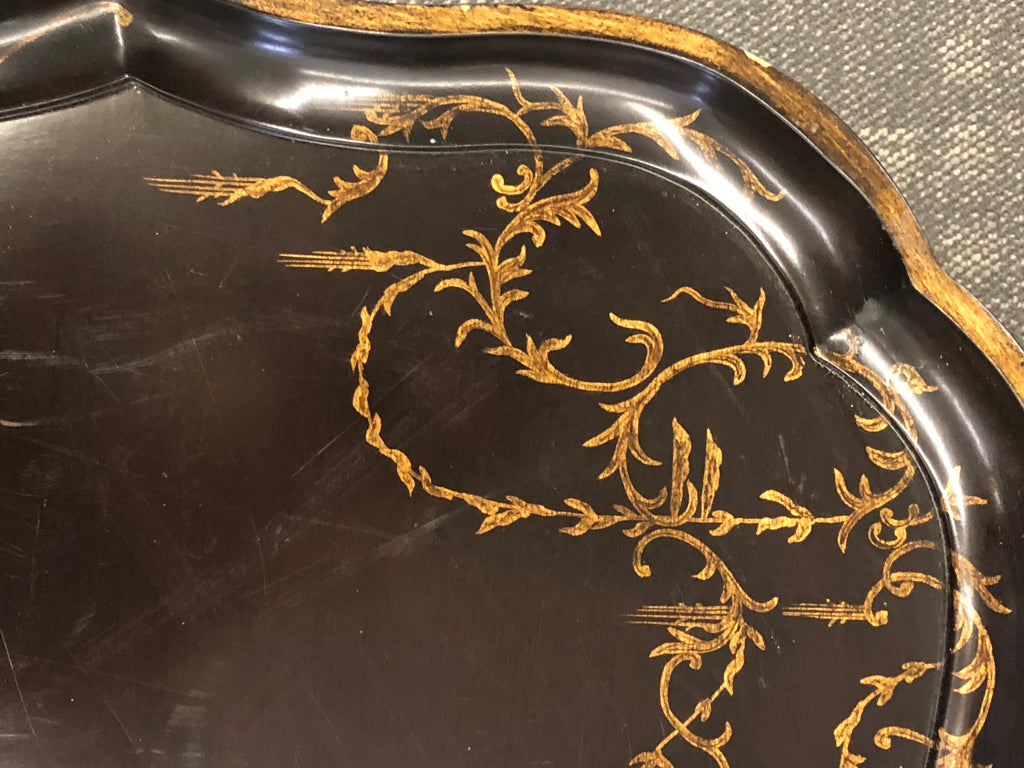 DARK BROWN TRAY TABLE W/ GOLD DETAILS.