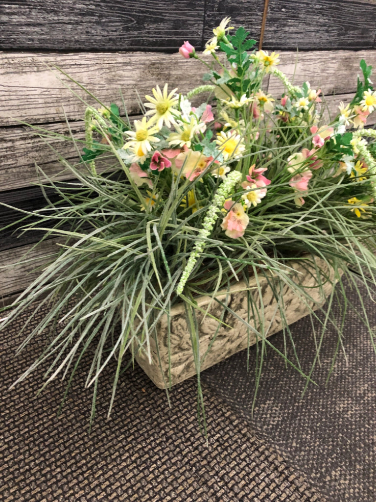 FAUX WILDFLOWERS IN HEAVY FAUX-STONE PLANTER.