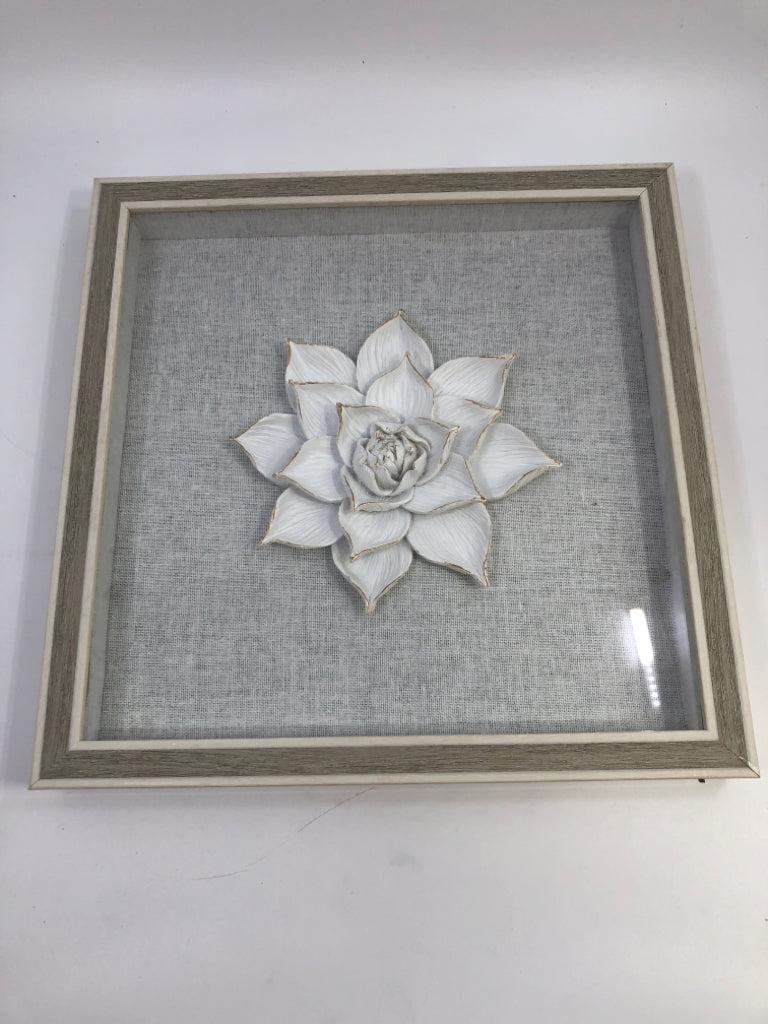 WHITE FLOWER IN GREY SHADOWBOX FRAME.