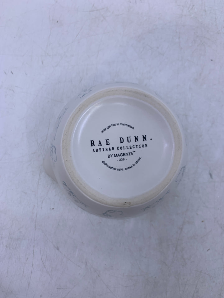 4 NESTING MEASURING CUPS W/ BLUE BUNNIES.