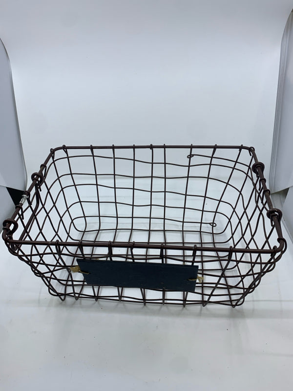 BROWN METAL WIRE BASKET W/ CHALK BOARD AND HANDLES.