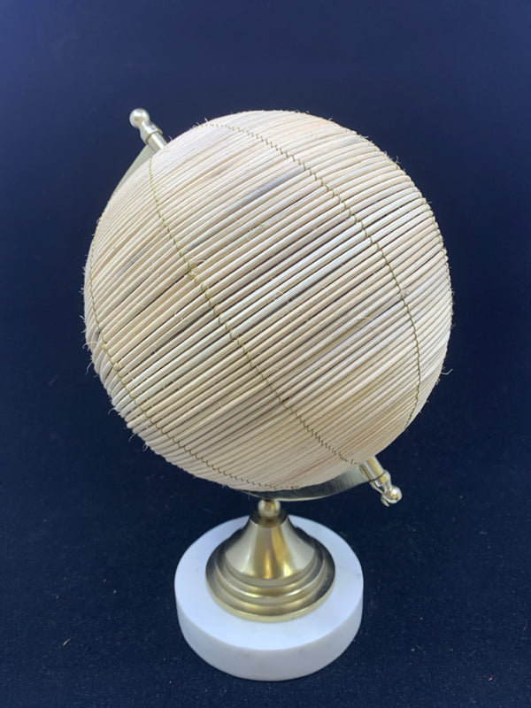 WOVEN GLOBE ON MARBLE STAND.