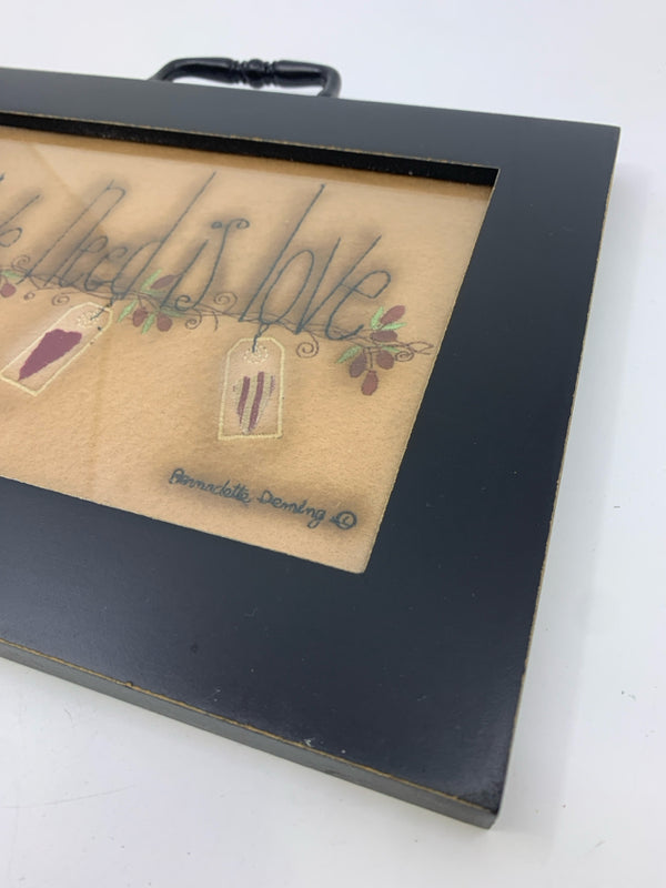 PRIMITIVE "ALL WE NEED IS LOVE" WALL HANGING IN BLACK FRAME.