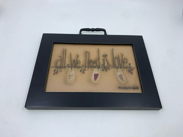 PRIMITIVE "ALL WE NEED IS LOVE" WALL HANGING IN BLACK FRAME.