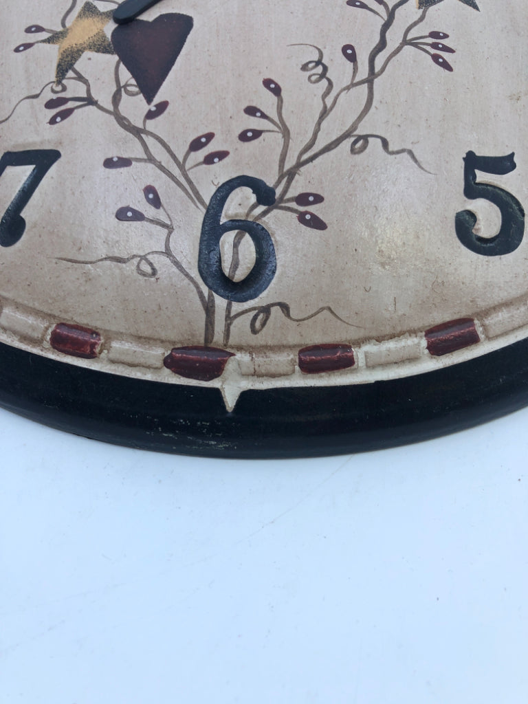 WOOD ROUND PRIMITIVE WALL CLOCK.