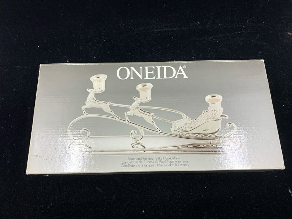 NIB ONEIDA SANTA AND REINDEER 3 TAPER CANDLE HOLDER.