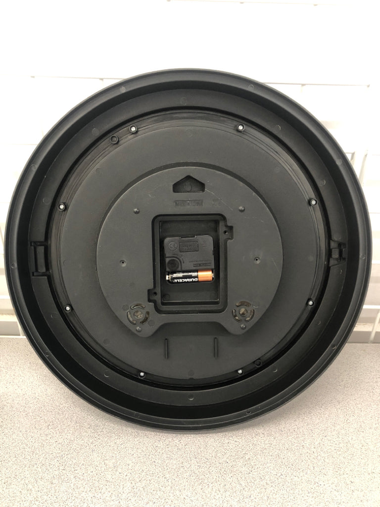 ROUND BROWN PLASTIC WALL CLOCK.