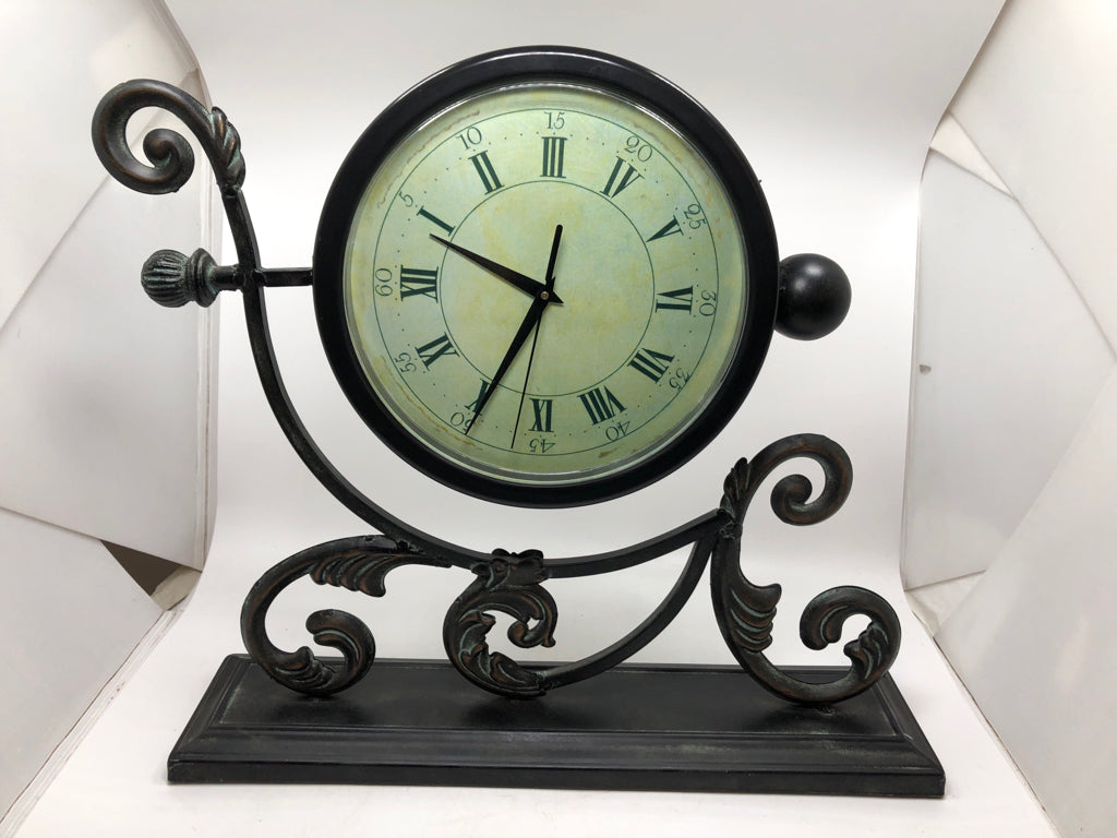 BRUSHED METAL SCROLL SHELF CLOCK.
