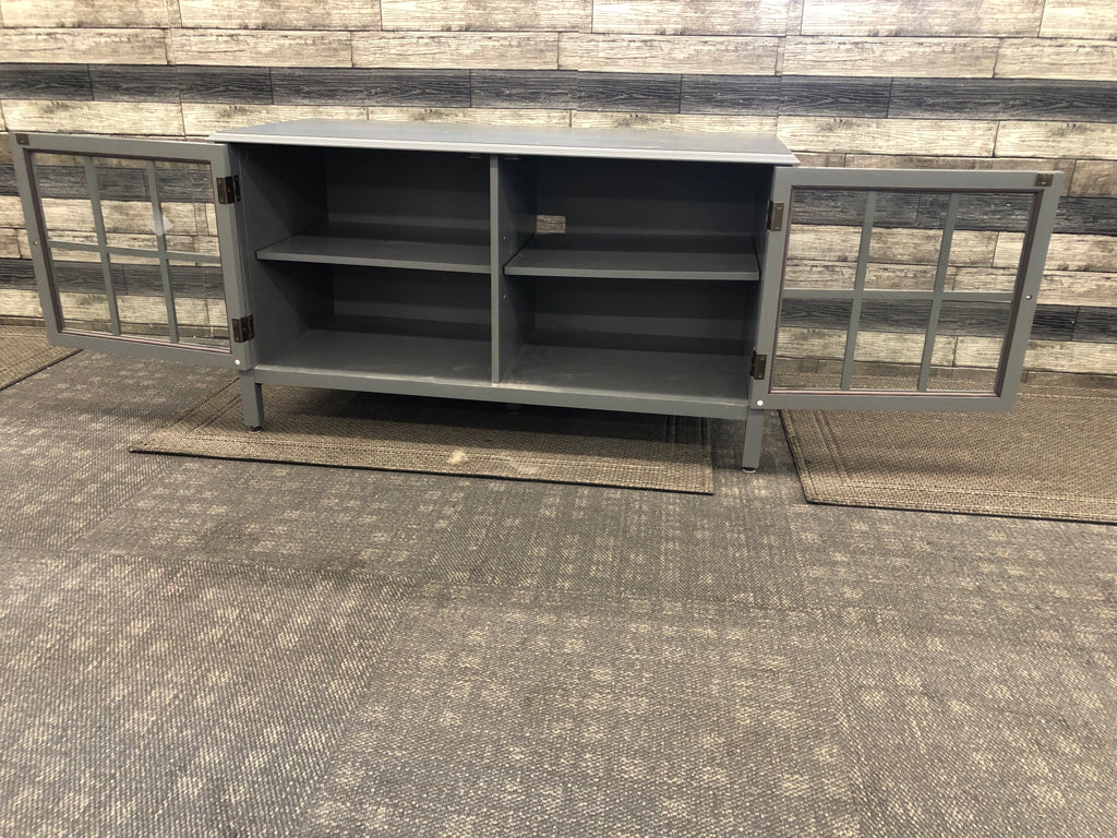 GREY ENTERTAINMENT CABINET W/1 SHELF AND GLASS DOORS.