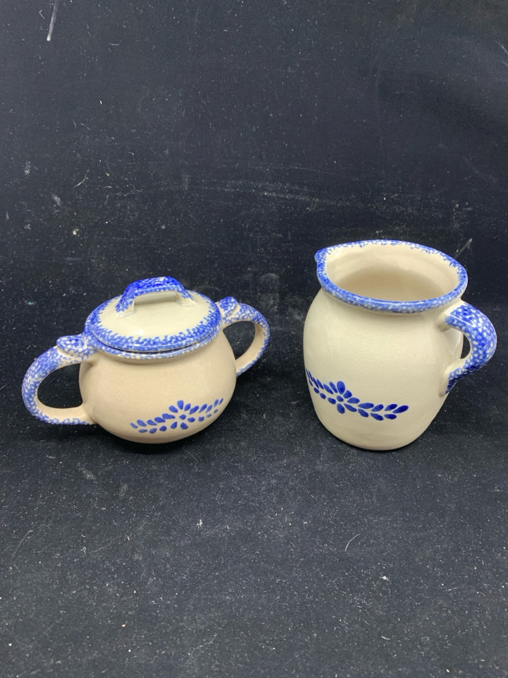 CREAM AND BLUE POTTERY CREAMER AND SUGAR.