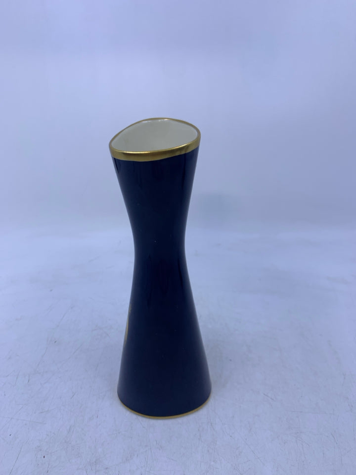 COBALT BLUE TRIANGLE SHAPED VASE W/ LEAF/STEMS FLOWERS.