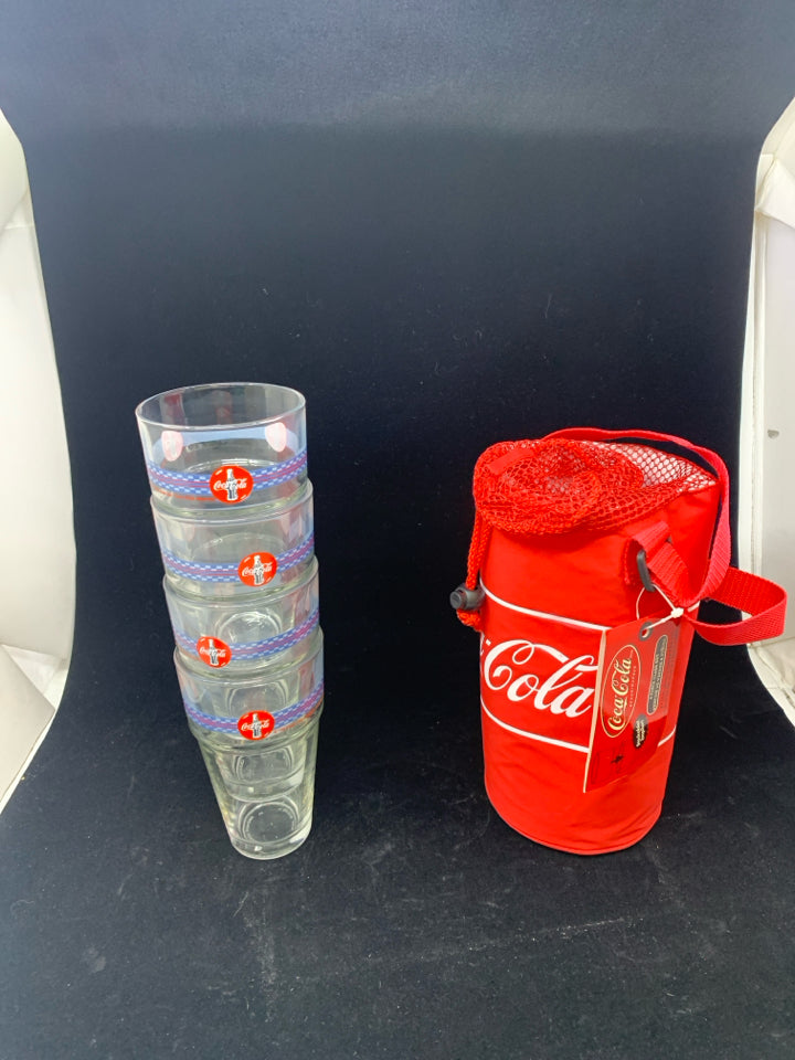 4 COCA-COLA THEMED STACKABLE GLASSES IN CARRYING SLEEVE.