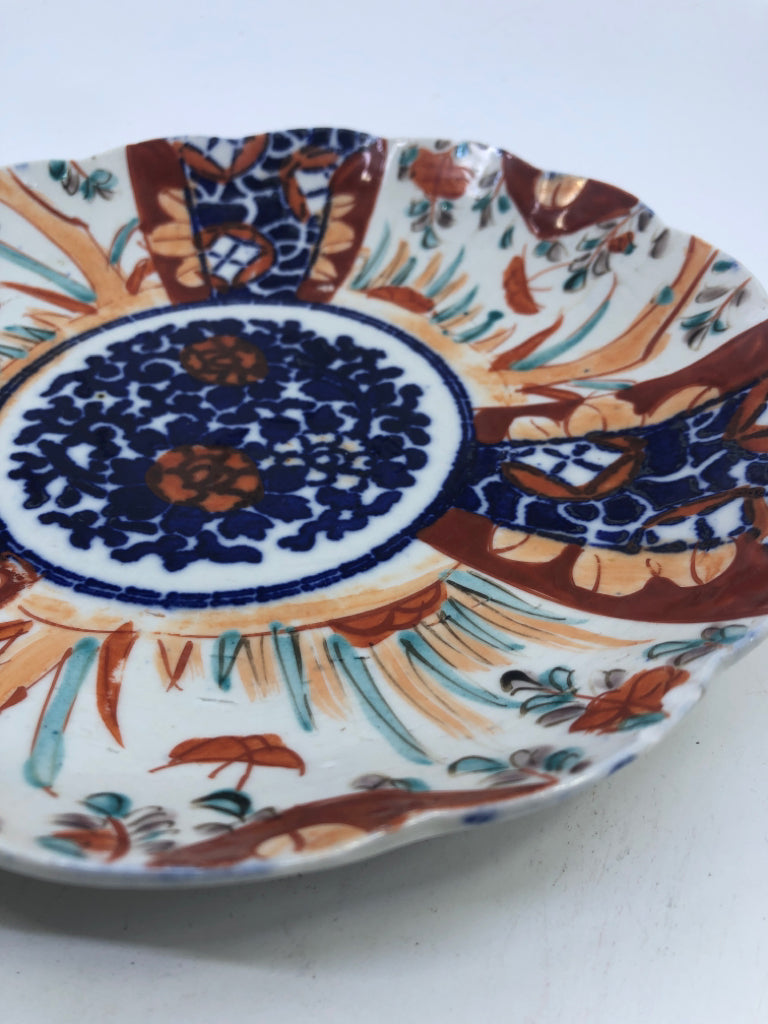 BLUE AND RED ABSTRACT FLORAL PLATE.