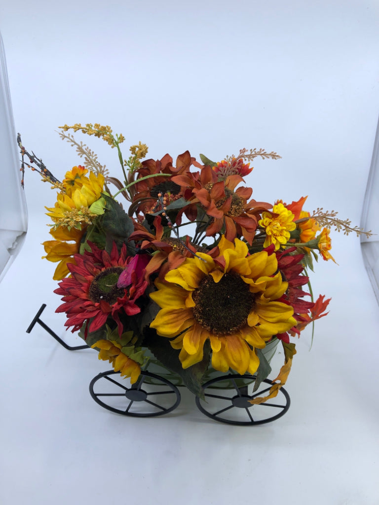 FAUX FALL BOUQUET IN GREEN METAL WAGON.