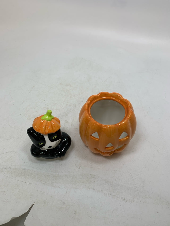 BLACK/WHITE CAT POPPING OUT OF JACKO LANTERN TEALIGHT HOLDER.