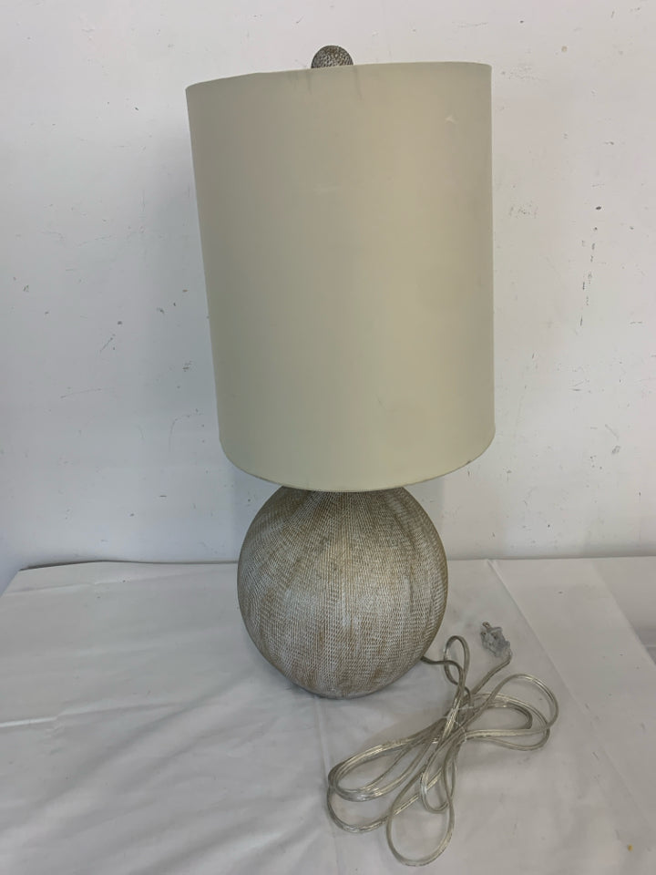 GREY PATTERN ROUND BASE LAMP W TAN SHADE.