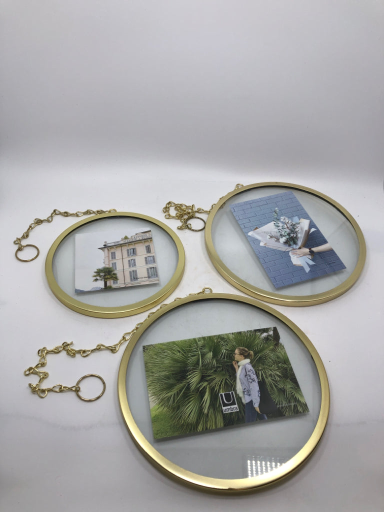 3 ROUND GOLD HANGING PHOTO HOLDERS.