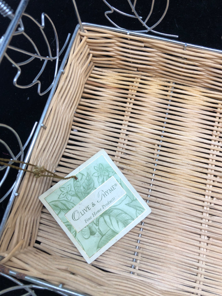 NWT WICKER BASKET W/METAL FRAME AND LEAF DECOR.