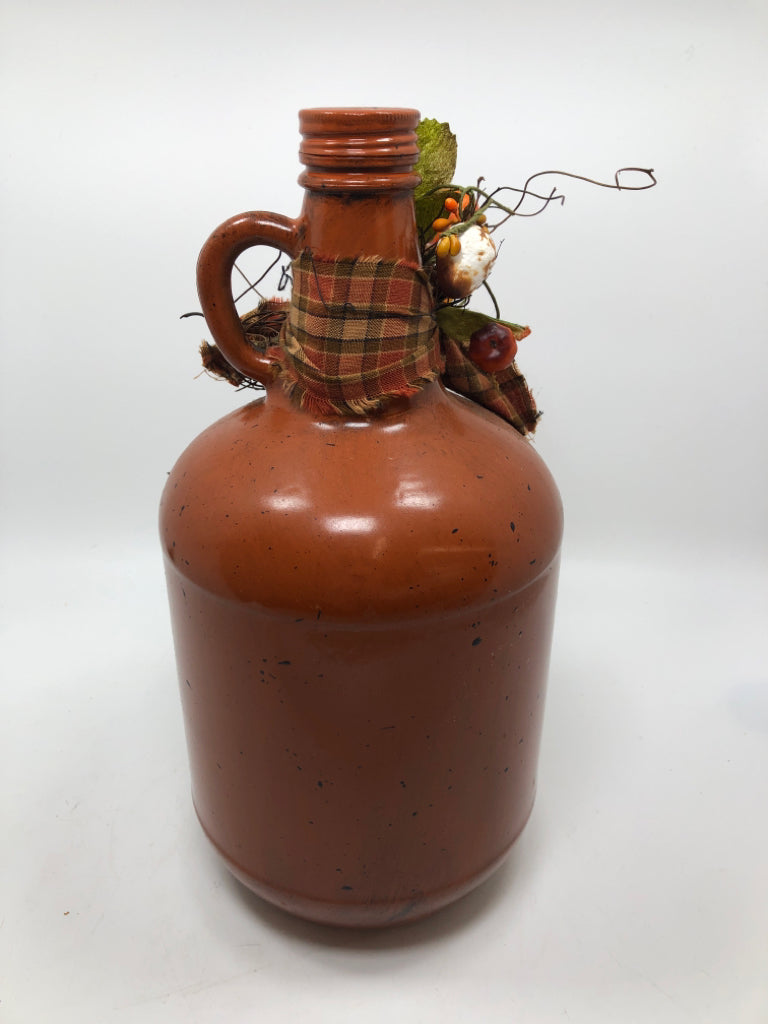 PRIMITIVE BROWN PAINTED GLASS JUG W/STAR AND PLAID BOW.