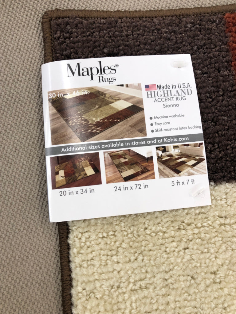 MAPLES HIGHLAND ACCENT RUG TAN & RED W/BROWN BORDER & THIN BRANCHES.