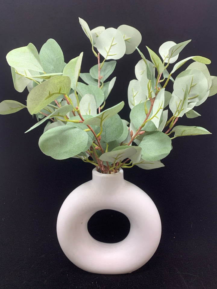 FAUX EUCALYPTUS IN ABSTRACT VASE.