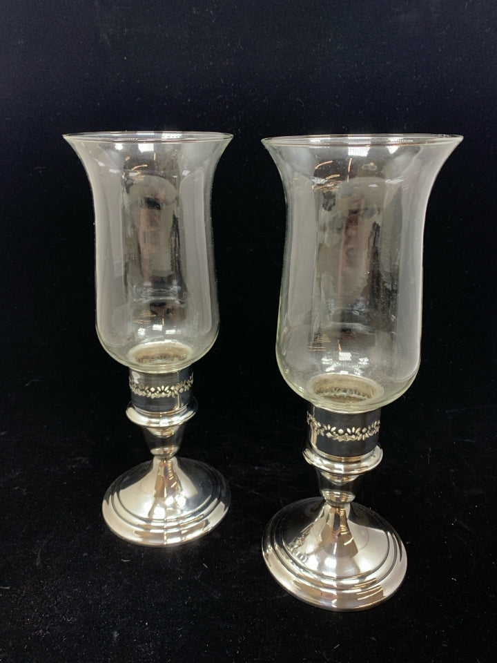 2 GLASS CANDLE HOLDERS W/SILVER BASE.