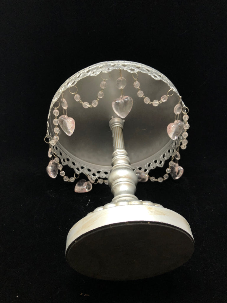 RAISED METAL CAKE STAND W/DANGLE HEART CHARMS.
