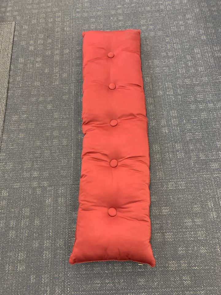 RED TUFTED BENCH CUSHION.