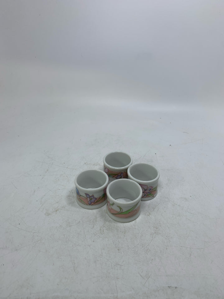 4 FLORAL PORCELAIN NAPKIN RINGS.
