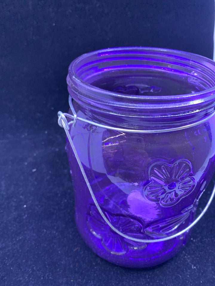 PURPLE GLASS BUTTERFLY AND FLOWER JAR W/ METAL HANDLE.