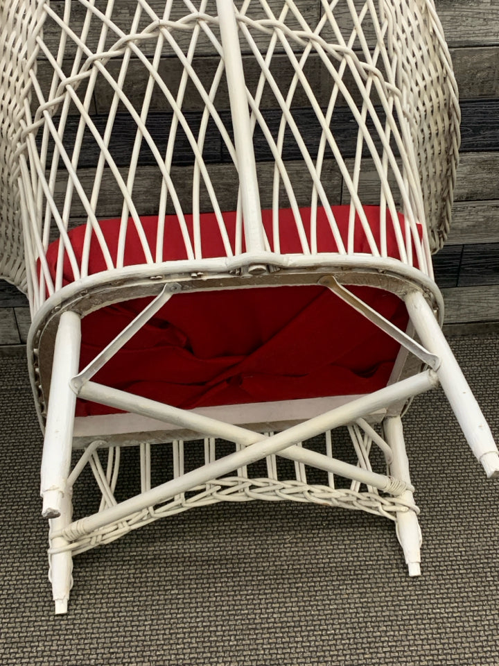 LOW WICKER WOVEN CHAIR W/ RED CUSHION.