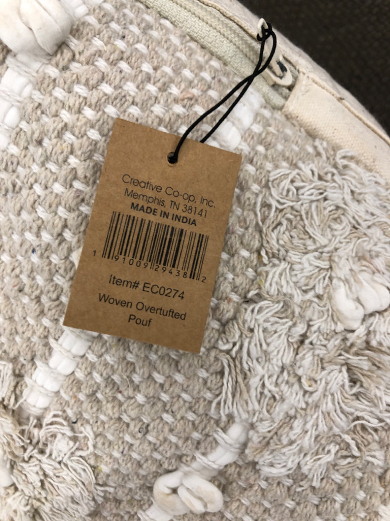 BEIGE TEXTURED COTTON WOVEN POUF OTTOMAN.