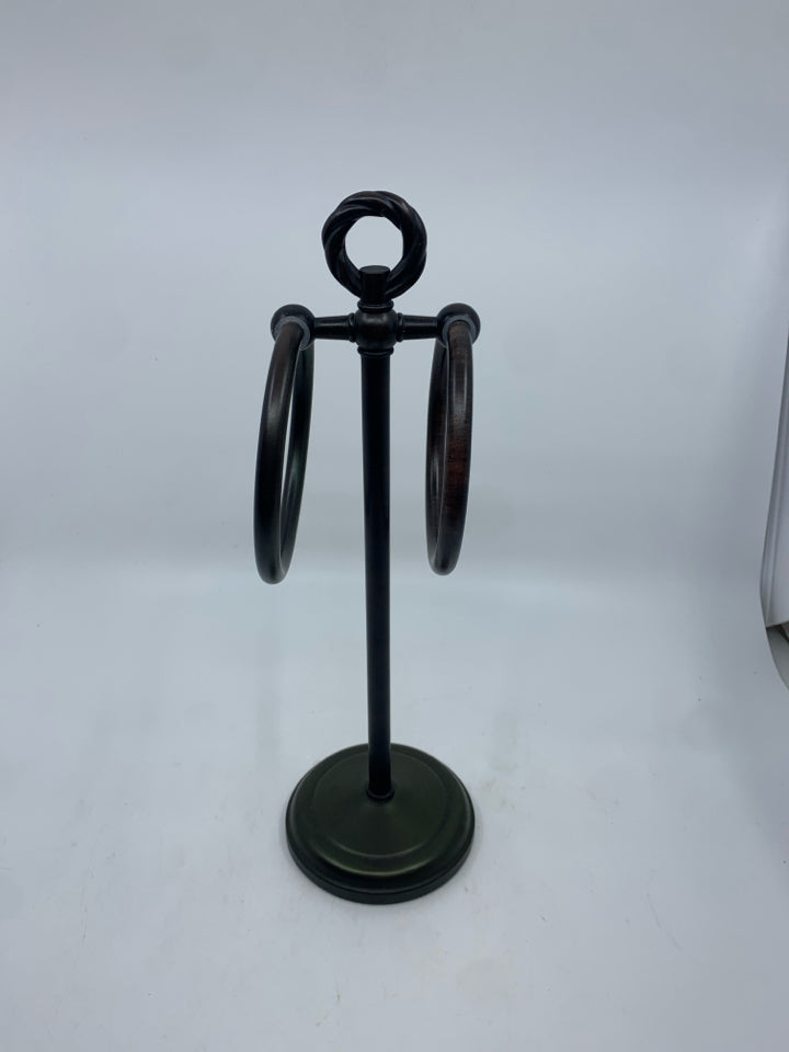 BROWN METAL TOWEL HOLDER.