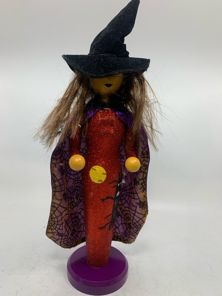 WITCH IN GLITTER DRESS.