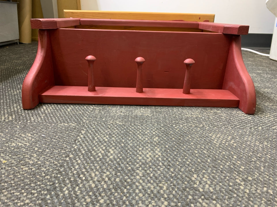 WOOD RED PAINTED SHELF W/ 3 HOOKS.