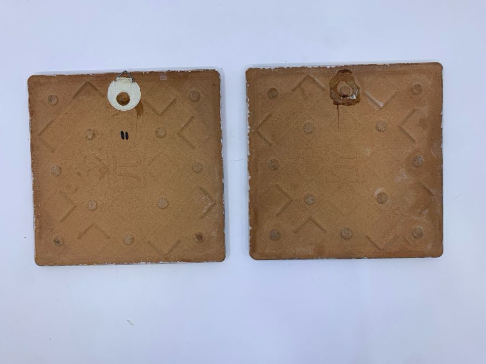 2 TERRA COTTA SPONGED COLORFUL TRIVETS.