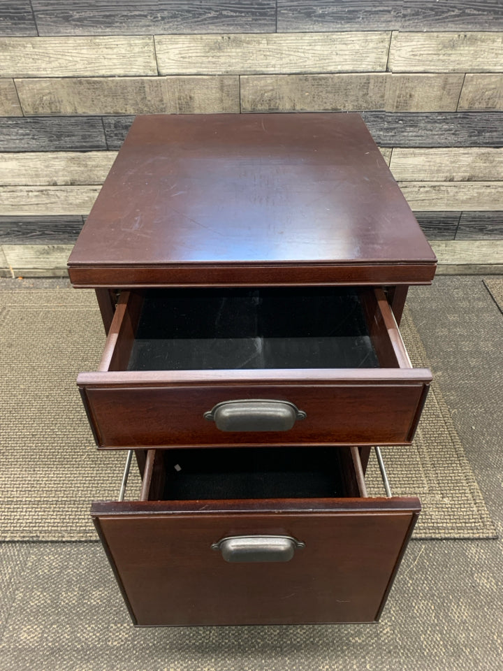 ROLLING DARK WOOD SIDE TABLE.