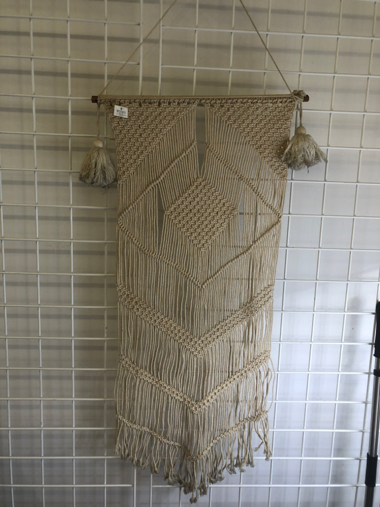 MACRAME WALL HANGING ON DOWEL W/ LARGE TASSELS.